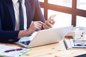 Wall Mural - Young businessman working with laptop at office