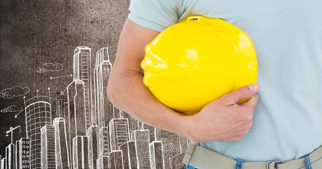 Canvas Print - Part of construction worker holding his yellow hard hat