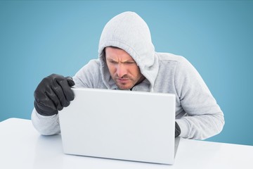 Poster - Hacker using laptop in office with blue background