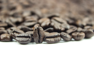 Wall Mural - Roasted coffee beans on isolated white background