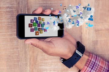 Poster - Part of man holding a smartphone with digital apps