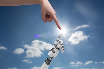 Poster - human hand is touching robot hand against sky background 