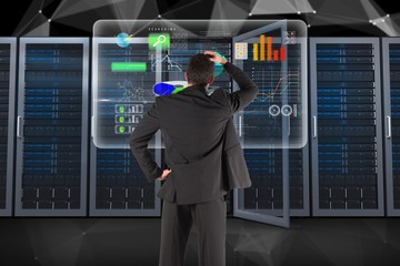 Poster - Businessman is analyzing data against database background