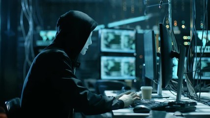 Aufkleber - Masked Hacktivist Organizes Massive Data Breach Attack on Corporate Servers. They're in Underground Secret Location Surrounded by Displays and Cables. Shot on RED EPIC-W 8K Helium Cinema Camera.