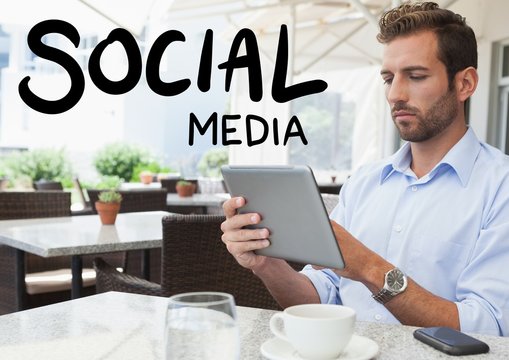 Social media text against man in cafe with tablet