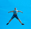 © Raman - Jumping up guy. Background blue sky.