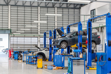 Car in the lifting equipment in the garage being repair and fix