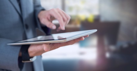 Poster - Businessman holding tablet in office