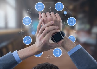 Poster - Businessman holding watch with apps icons in large room
