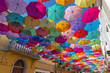 The sky of colorful umbrellas.Street with umbrellas.Umbrella Sky Project in Agueda, Aveiro district, Portugal.Background colorful umbrella street decoration