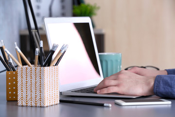 Wall Mural - Man working on laptop at table