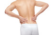 © Africa Studio - Young man suffering from back pain on white background