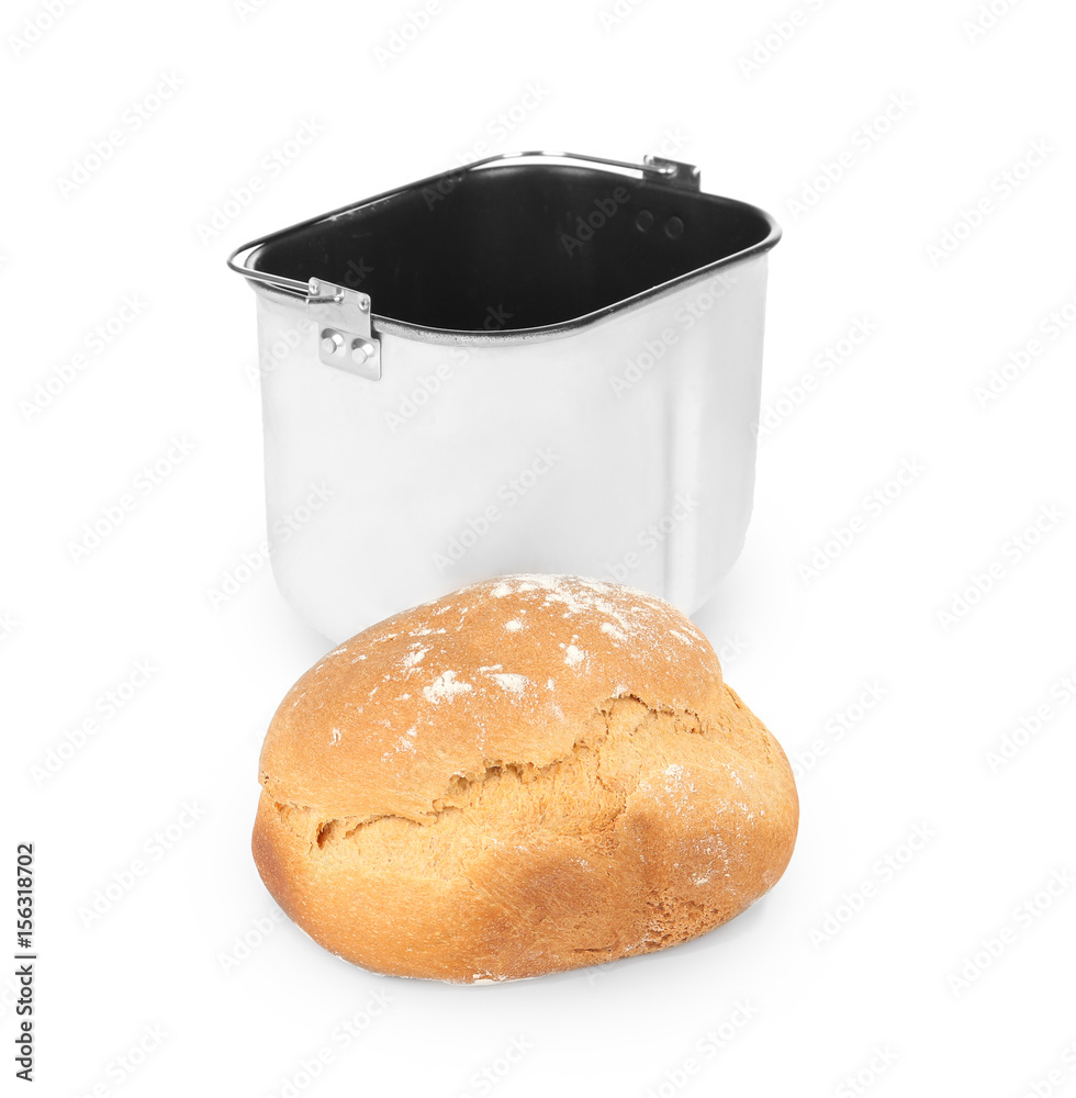 Baking pan and fresh homemade bread on white background