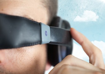 Poster - Close up of VR headset on man against sky