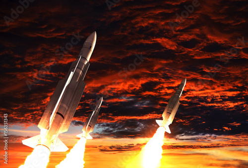Plakat Trzy rakiety startują na tle apokaliptycznego nieba