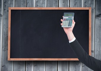 Sticker - Hand with calculator against chalkboard and grey wood panel