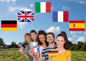 Wall Mural - main language flags around group teenagers with flags in field