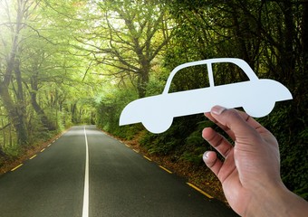 Poster - Cut out car in hand on road