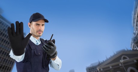 Wall Mural - Portrait of security guard showing stop gesture 