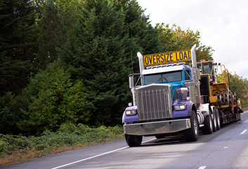 Oversize load big rig classic semi truck with step down flat bed