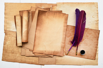 old paper with feather and ink for background