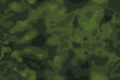 Seamless pattern. Abstract military or hunting camouflage background. Green color shapes with sqare gray grid.