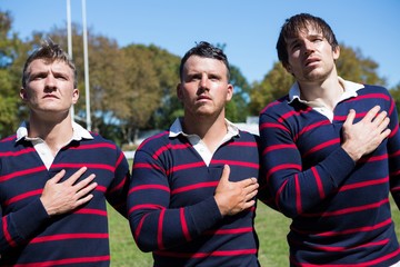 Wall Mural - Close up of rugby players looking away