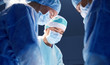 © Syda Productions - group of surgeons in operating room at hospital