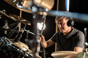 Wall Mural - male musician playing drums and cymbals at concert