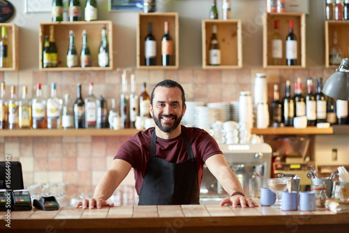 Cuadros en Lienzo happy man, barman or waiter at bar