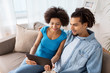 © Syda Productions - smiling happy couple with tablet pc at home