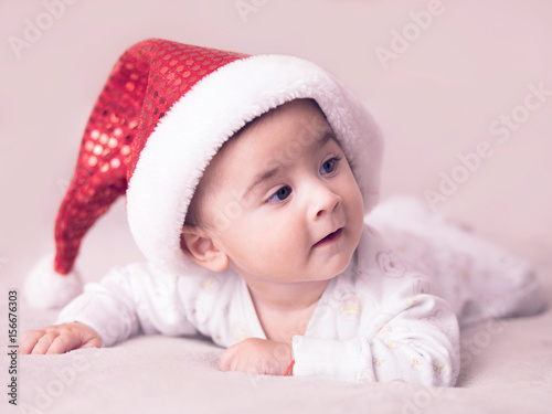 Fotografie, Obraz Portrait of baby boy wearing christmas hat.