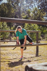 Wall Mural - Fit women training on fitness trail in the boot camp