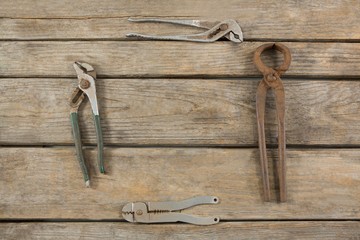 Wall Mural - Rusty tools arranged on wooden table