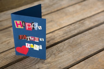 Wall Mural - High angle view of happy fathers day greeting card on table