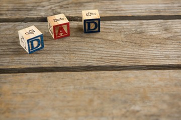 Wall Mural - High angle view of cube shapes with dad text 