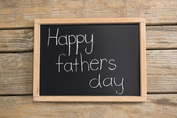 Wall Mural - Overhead view of slate with happy fathers day text on table