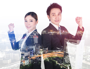 Wall Mural - double exposure of successful business man and woman with arm raised with city background