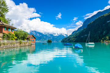 Bay of  Lake Brienz at Village Iseltwald - beautiful lake in the alps at Interlaken, Switzerland