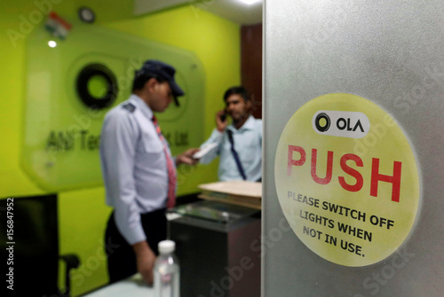 An Employee Speaks Over His Phone As A Private Security Guard