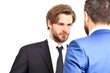 © be free - aggressive men in jacket speaking with businessman