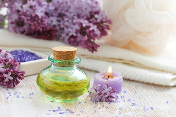  SPA setting with candles, aroma oil and lilac