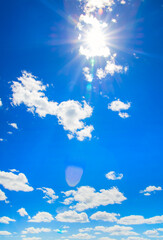 white fluffy clouds in the blue sky