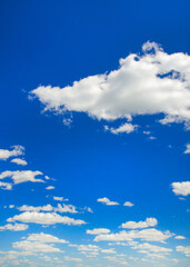 Wall Mural - white fluffy clouds in the blue sky
