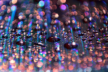 Multicolored Water Droplets Close-up. Beautiful Bokeh.