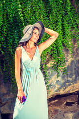 Young American Woman traveling, relaxing at Central Park, New York, in summer