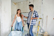 © didesign - Beautiful young couple renovating their home
