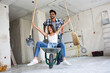 © didesign - Loving couple is having fun while they are renovating house
