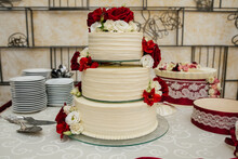 White Wedding Cake With Flowers And Blueberries