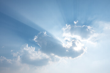 Wall Mural - sun rays behind clouds